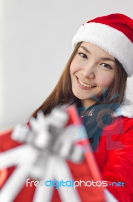 Santa Claus Hat With Red Christmas Gift Box Stock Photo