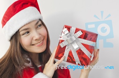 Santa Claus Hat With Red Christmas Gift Box Stock Photo