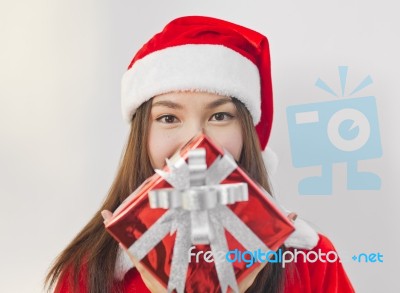 Santa Claus Hat With Red Christmas Gift Box Stock Photo