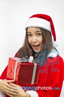 Santa Claus Hat With Red Christmas Gift Box Stock Photo