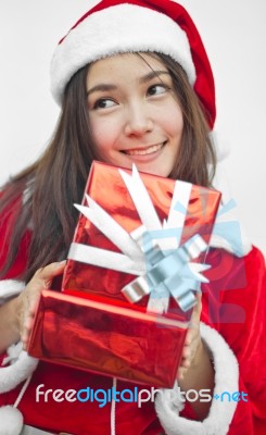 Santa Claus Hat With Red Christmas Gift Box Stock Photo