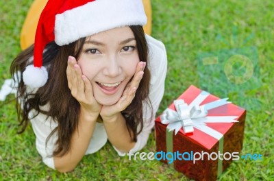 Santa Claus Hat With Red Christmas Gift Box Stock Photo