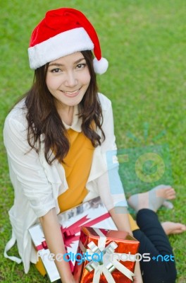 Santa Claus Hat With Red Christmas Gift Box Stock Photo