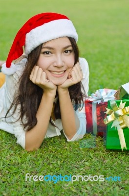 Santa Claus Hat With Red Christmas Gift Box Stock Photo