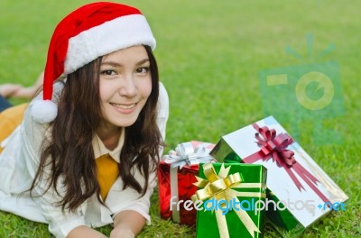 Santa Claus Hat With Red Christmas Gift Box Stock Photo