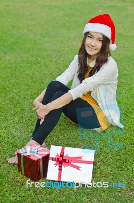 Santa Claus Hat With Red Christmas Gift Box Stock Photo