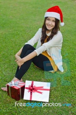 Santa Claus Hat With Red Christmas Gift Box Stock Photo