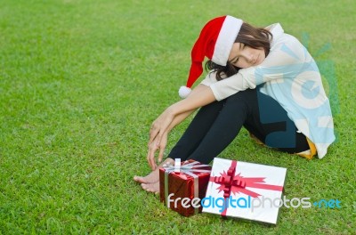 Santa Claus Hat With Red Christmas Gift Box Stock Photo