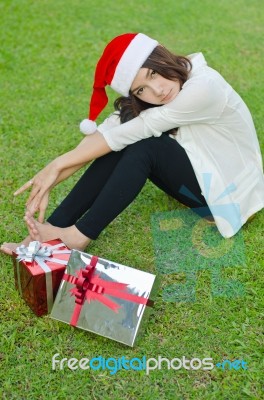 Santa Claus Hat With Red Christmas Gift Box Stock Photo