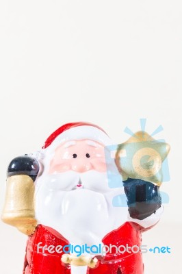 Santa Claus Holding Gold Star And Bell Stock Photo