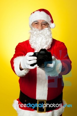 Santa Claus Holding Up His Brand New Dslr Stock Photo