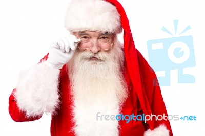 Santa Claus  Looking Above His Spectacles Stock Photo