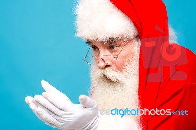 Santa Claus Looking His Open Palms Stock Photo