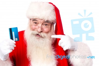 Santa Claus Showing  Credit Card Stock Photo