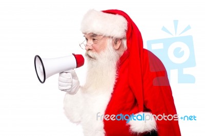 Santa Claus Speaking Via Megaphone Stock Photo