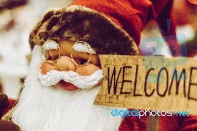 Santa Claus Statue Holding The Welcome Sign Stock Photo