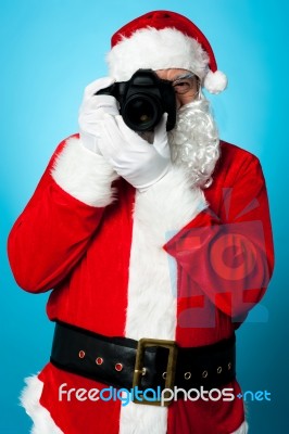 Santa Claus Turns Into A Pro Photographer Stock Photo