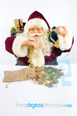 Santa Claus With Gifts And Money Coins Stock Photo