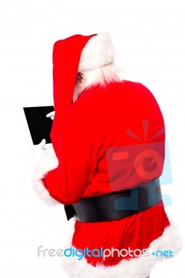 Santa Claus With Tablet Device Stock Photo