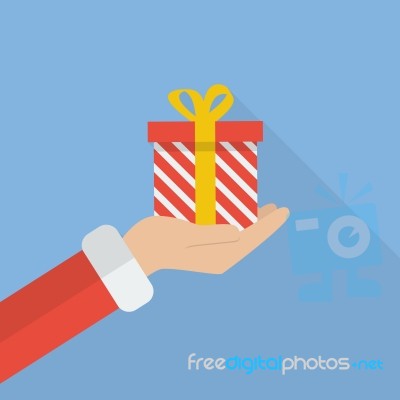 Santa Hand Holding Christmas Gift Box Stock Image