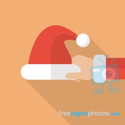 Santa Hand Holding Santa Hat Stock Image