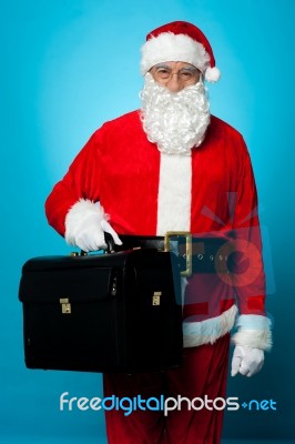 Santa Is All Set To Visit His New Office, Holding Briefcase Stock Photo