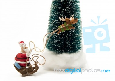 Santa On Sleigh With One Reindeer Stock Photo