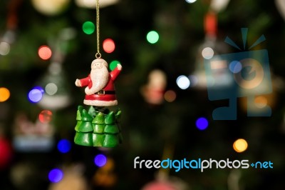 Santa Over Green Tree Ornament Hanging On Christmas Tree Stock Photo