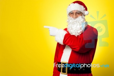 Santa Pointing Away Towards Something Stock Photo