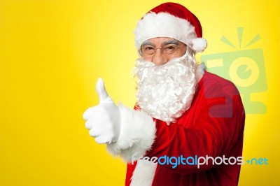 Santa Showing Thumbs Up Gesture To Camera Stock Photo