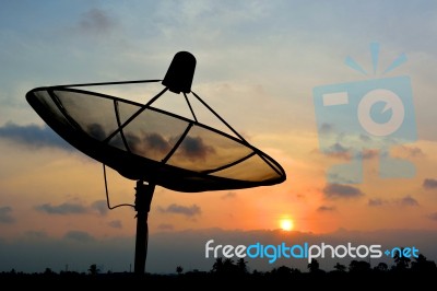 Satellite Dish And Colorful Sky Stock Photo