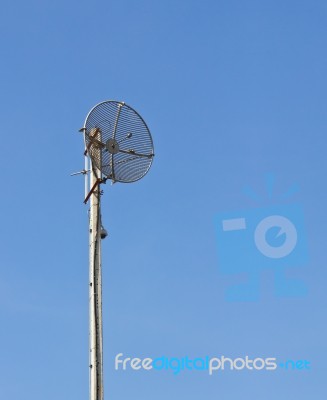 Satellite Dish On Pole Stock Photo