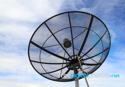 Satellite Dish With Blue Sky Background Stock Photo