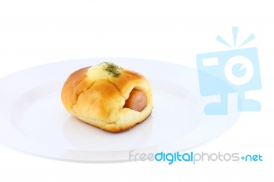 Sausage In Bread And Cheese On Dish Near View Stock Photo