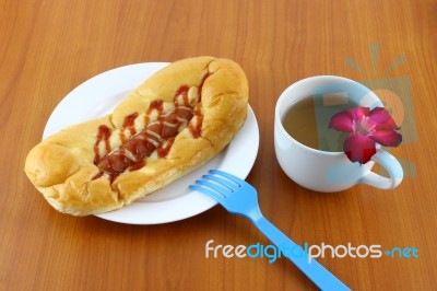 Sausage Salad Cream And Ketchup Bread With Tea On Table Stock Photo