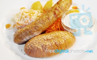 Sausages With Vegetables On A Plate Closeup Stock Photo