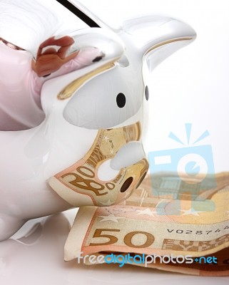 Saving Euros Cash In Piggy Bank Stock Photo