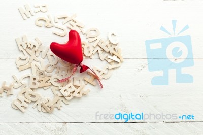 Scattered Wooden Letters And A Red Heart Stock Photo