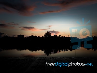 Scenery Of The Wooden Pier In Urban Stock Photo