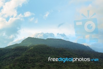 Scenic Of Clouds Over Mountain Stock Photo