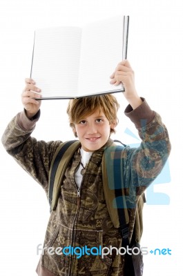 School Boy At Camera Showing Copy Space Stock Photo