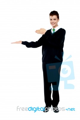 School Boy Introducing Gesture Stock Photo