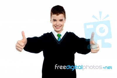 School Boy Showing Thumb Up Stock Photo