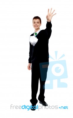 School Boy Throwing Paper Stock Photo