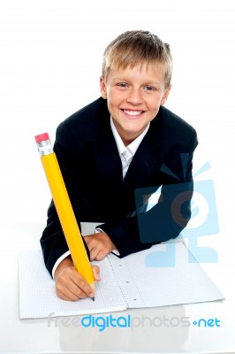 School Boy Writing Stock Photo