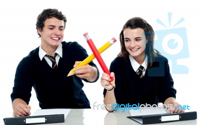 School Friends Holding Big Pencil Stock Photo