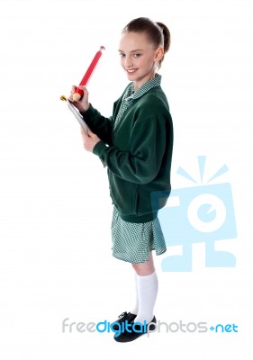 School Girl Holding Big Pencil Stock Photo