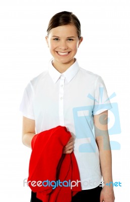 School Girl Holding Her Red Sweater Stock Photo