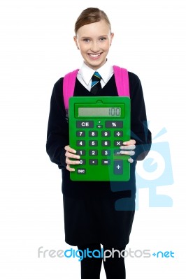 School Girl Holding Large Green Calculator Stock Photo