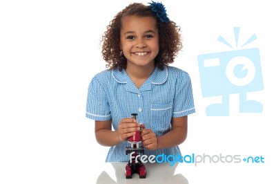 School Girl Playing With Microscope Stock Photo